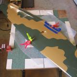 Clamps and tape hold the wing halves while the epoxy sets.