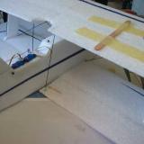 The top aileron was held in neutral by popsicle sticks so the rod connecting the ailerons could be adjusted and glued.