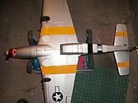 Name: GEDC001616.jpg
Views: 196
Size: 114.2 KB
Description: I covered the black stripes with low temp yellow film. Just for my eyes when this plane is high in the sky. Black stripes on top, yellow on bottom.