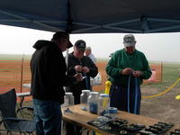 Name: DSCN7315.jpg
Views: 195
Size: 78.0 KB
Description: Every year we set up a pop up tarp and bring tables to put out the prizes...and we start getting pilots signed up.  We have raffles for three nice items (Plane, motor, pop up tarp) and we've got a pilot's drawing for a DX7 radio.  The raffles al