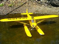 Name: J3 on floats.jpg
Views: 243
Size: 72.2 KB
Description: Hanger 9 J-3 on Great Planes built up floats.  Saito 56