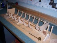 Name: Lady Margaret 006.jpg
Views: 296
Size: 91.7 KB
Description: Rearmost post is rudder post, dry fit. It will be removed to drill hole for stuffing tube.