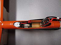 Name: IMG_0085.jpg
Views: 974
Size: 79.0 KB
Description: Controller is lifted up to insert battery.  Plywood stopper secured with velcro holds battery from sliding forward.  A balsa block behind keeps it from sliding back.