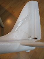 Name: 19.jpg
Views: 158
Size: 145.2 KB
Description: I push on the little tabs over the stab on both side, then I pull down the plastic tab under the tail boom to remove the stabilizer