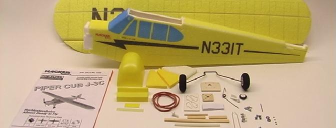 The complete kit contents, including painted wings, tail and fuselage and items to complete the build