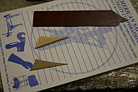 Name: IMG_5280.jpg
Views: 215
Size: 63.8 KB
Description: Materials for making the skeg, cardboard template, 1/8" plywood center, and 1/32" phenolic lamination.