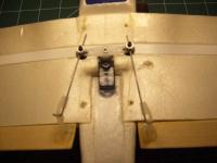 Name: Picture 099.jpg
Views: 383
Size: 45.9 KB
Description: Aileron servo and push rods which are .032 wire rods.