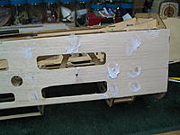 Name: IMG_0184.jpg
Views: 43
Size: 204.9 KB
Description: Upper and lower balsa sheeting completed. Light weight filler applied and waiting for sanding.