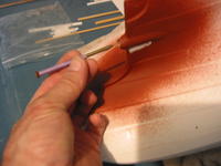Name: 100-0048_IMG_2.jpg
Views: 145
Size: 71.1 KB
Description: Here I use a nail with masking tape to hold in the prop shaft to keep any puddy or paint out. Works great!