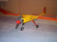 Name: DCP01719.jpg
Views: 87
Size: 44.0 KB
Description: My modified Oly 650 . Shortened nose, Norvel .15 , R E T w/steerable nosewheel . Undercambered airfoil . 