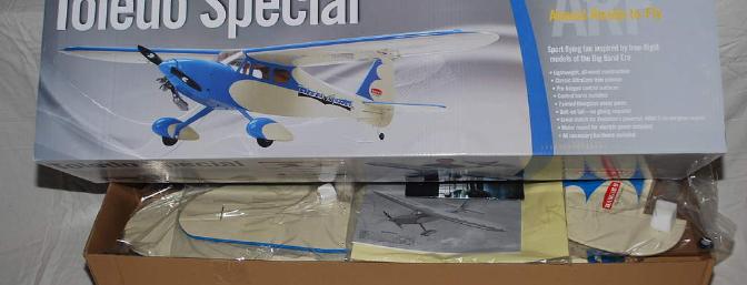 The colorful box contains a beautiful model covered in cream and blue.
