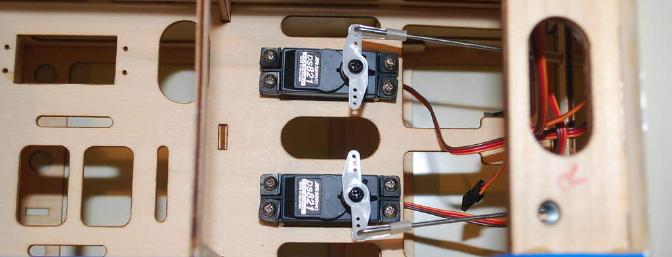 The JR DS821 high torque servos were a perfect drop-in fit. 90 degree bends are factory made, and nylon keepers secure the push-rod control ends to the servo output arms.