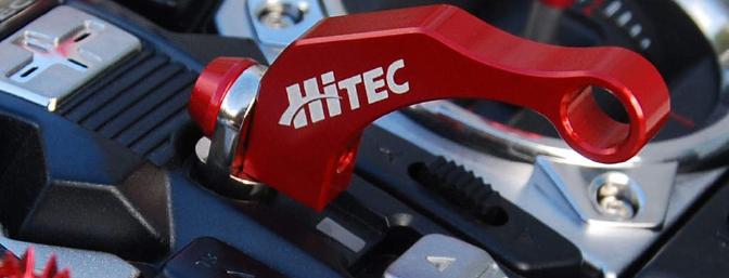 Hitec has just released this attractive neck strap balance.  This attaches to the existing strap eyelet and will perfectly balance the transmitter when used with the 2.4GHz module.