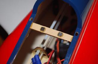 Then a 5mm wide lite ply base was glued to the fuselage right under the canopy lip.  Two magnets were glued to this. After that epoxy was cured the other magnets attach themselves to the other magnets. Then a drop of epoxy on the top of each magnet and reattach the canopy.  Allow the glue to dry and remove the canopy - simple!