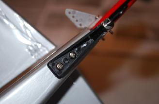 Two small screws attach the mount to the fuselage.