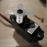 The Futaba s3107 servos - very impressive fast and light.   They fit without modification.