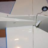 The long bolts go in the rear of the fuselage, and they attach the entire tail surface with two lock nuts.