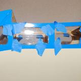 The windows were held with some low-tack tape while the glue dried.