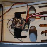 It is advisable to use some double sided foam tape to permanently mount the receiver.