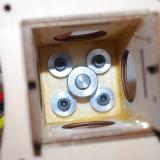 Here you see the inside of the box.  I used some large washers to spread the load onto the wood.  The collet is attached to the rear of the shaft.  Hardware for mounting the motor was not included with the Telemaster Plus.