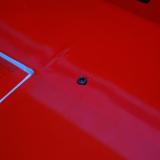 The bolt passes through the hole you drilled securing the wing to the fuselage.  These two bolts along with the wing struts will keep the wing from sliding off the tubes.