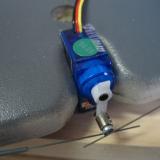  The top mounting tab on the servo had to be removed for clearance of the battery tray. Also included is a plastic insert tube for use with the EZ connector.  This plastic is important and helps to bind both aileron wires in the connector.  