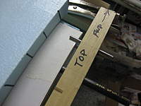 Name: wing tube jig 002.jpg
Views: 590
Size: 53.7 KB
Description: Tool plugged in, top pin resting on top skin, ready to drill drive pin hole.  I use 1/8" rod for the drive pin, and I thread 1" of the end that engages.   With a 1/2" root rib, I thread/epoxy the vertical grain balsa/ply sandwich as well as