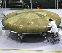 Name: heat_shields.jpg
Views: 366
Size: 134.3 KB
Description: The first heat shield for the CEV was made.  It's the largest ablative heat shield ever made, but appears deceptively big by the small worker standing next to it.
