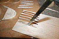 Name: IMG_2881.jpg
Views: 446
Size: 179.0 KB
Description: Cutting ribs using ply template with pins fixed with CA to grip sheet
