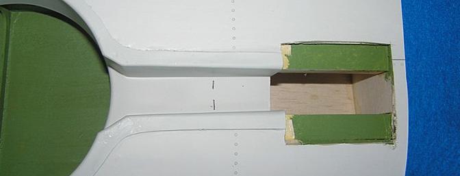 Plastic wheel well had to be trimmed to permit the retract unit to fit. Note the dotted line. This section also has to be painted, after all we wouldn't want this plastic to corrode in the salt water breeze while sitting on the carrier.