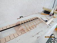 Name: IMG_2960.JPG
Views: 378
Size: 2.19 MB
Description: The ribs of the right tip are glued onto the spar, and the root rib is held against the poly jig.