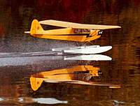 Name: Q-F_J3-KETTERING-98-001.jpg
Views: 600
Size: 22.0 KB
Description: My 9' wingspan, kit built Bud Nosen J-3 on the step and ready to R.O.W. @ Lake Kettering in Maryland during a club Float Fly in 1981. Powered by an O.S. Gemini 120