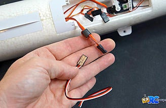 Use the old servo lead as a wire pull