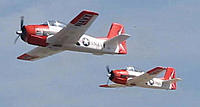 Name: MVI_1706__4.jpg
Views: 288
Size: 13.5 KB
Description: Antonio flying the T-28 (right and me (left) during the Noon Nitroplanes Demo. Photo by alpea41