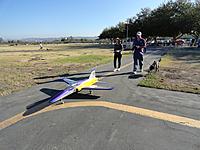 Name: DSC09370.jpg
Views: 259
Size: 161.6 KB
Description: Evelyn, John Redman and Mia "The Jet Dog" taxi the JetCat USA Ultra Flash to the Apollo Field Runway during LA Jets on Nov 10, 2013