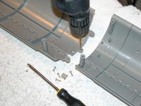 Name: DSCN0088.jpg
Views: 970
Size: 79.9 KB
Description: The union between the forward and aft hull quarters is very good -- simple and strong. Good engineering here. However, the holes that pass the screws had to be enlarged a bit. No biggie.