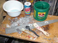 Name: DSCN0166.jpg
Views: 961
Size: 123.6 KB
Description: Using an abrasive to impart a 'scratch-finish' to the styrene parts. Variouse type brushes were used to dig the abrasive into all areas of the plastic parts