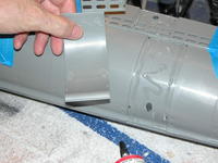 Name: DSCN0014.jpg
Views: 891
Size: 74.4 KB
Description: Tube glue is slathered onto the hull and the doublers installed and held in place with tape.
