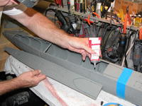 Name: DSCN0011.jpg
Views: 836
Size: 107.0 KB
Description: You can lay a bead of tube glue to the capture lip before installing the deck piece, like I'm doing here. Or, you can install the deck pieces dry and brush on liquid cement into the hull-deck union crack, letting capillary action work the cement to a