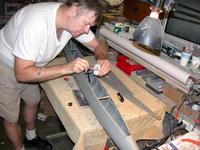 Name: DSCN0022.jpg
Views: 1103
Size: 111.6 KB
Description: An alternative to gluing the keel section of the two hull halves together from the outside, you can do it from the inside like I'm doing here, before installing the two deck pieces.