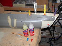 Name: DSCN0033.jpg
Views: 978
Size: 91.4 KB
Description: Securing the Renshape-20 filler blocks to the bow with five-minute epoxy