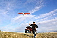 Name: .jpg
Views: 69
Size: 282.2 KB
Description: Myself launching my "Coyote." I really enjoy flying this little thing.  It's a sturdy little plane on landing, (probably cuz it's mostly epoxy!!!)
