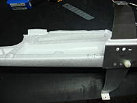 Name: DSC00447.jpg
Views: 229
Size: 39.5 KB
Description: Planning the best point to cut belly hatch behind landing gears (I need here) on lighter position to the front of the plane. Note that it's not a traditional cut from the front edge of the wing. I preffer to make it stronger for the final weight (big) but