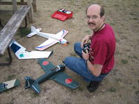 Name: IMG_2919.jpg
Views: 209
Size: 146.0 KB
Description: My friend Rick with his GWS Zero... thank god he finally retired this thing. Fly. Crash. Repair. and repeat.