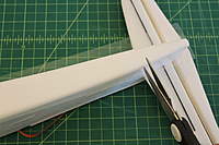 Name: IMG_3852.jpg
Views: 193
Size: 54.4 KB
Description: Cut a slit where it tapers in at the tail end area. This will prevent wrinkles in the tape.