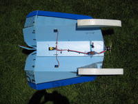 Name: Capricorn 7-08 025.jpg
Views: 868
Size: 119.5 KB
Description: Bottom view.  The length out the front isn't important but the step of the floats should go behind the CG by 1/2 inch.  On this plane the CG is 7" from the nose and 5" from the bend in the wing.  Keep the float square and ugly.  