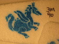 Name: 019.jpg
Views: 2108
Size: 92.9 KB
Description: Stenciled dragon on EPP surface prepared with 3M90.  3M90 dries completely and is not sticky but has a rougher surface.