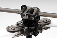 Name: Rotor Head.jpg
Views: 1885
Size: 47.2 KB
Description: The two locking screws, one of each side of the shaft, are located just below the flybar and above the upper blades.