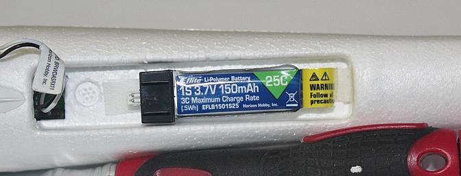 The flight battery came with a piece of matching hook and loop already stuck to it to allow it to be installed in the battery compartment.