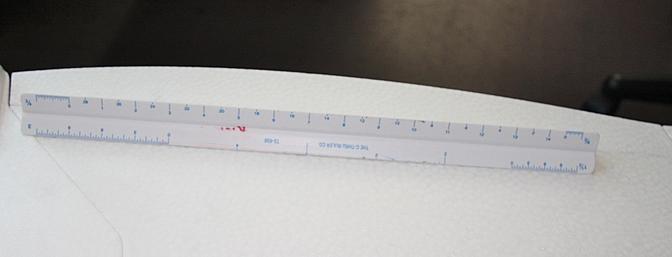 A ruler with a metric side was used to measure where to make the cuts in the aileron hinge line.